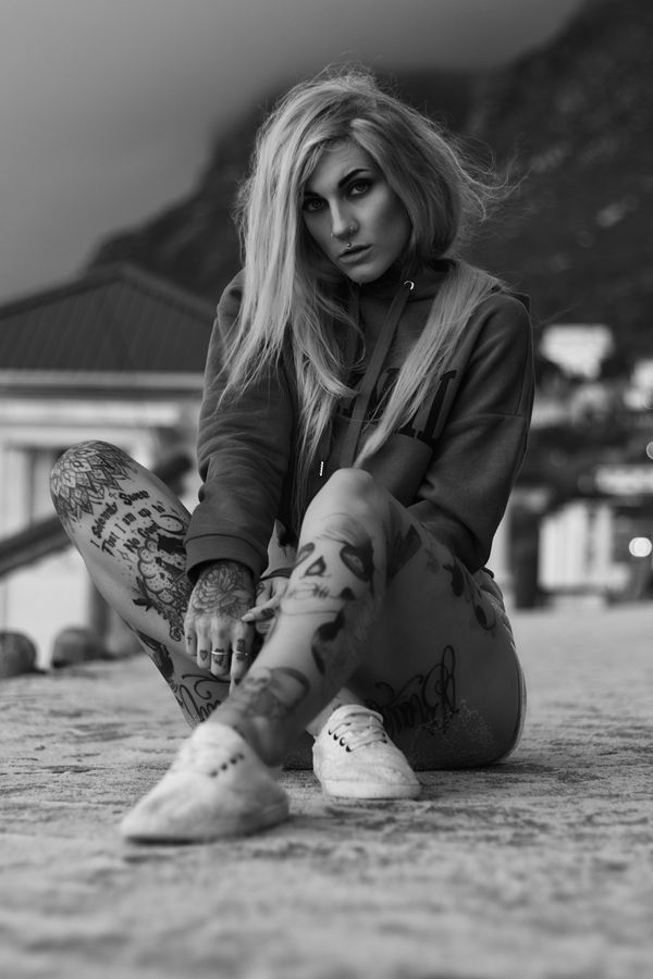 Black and white portrait seated on a promenade